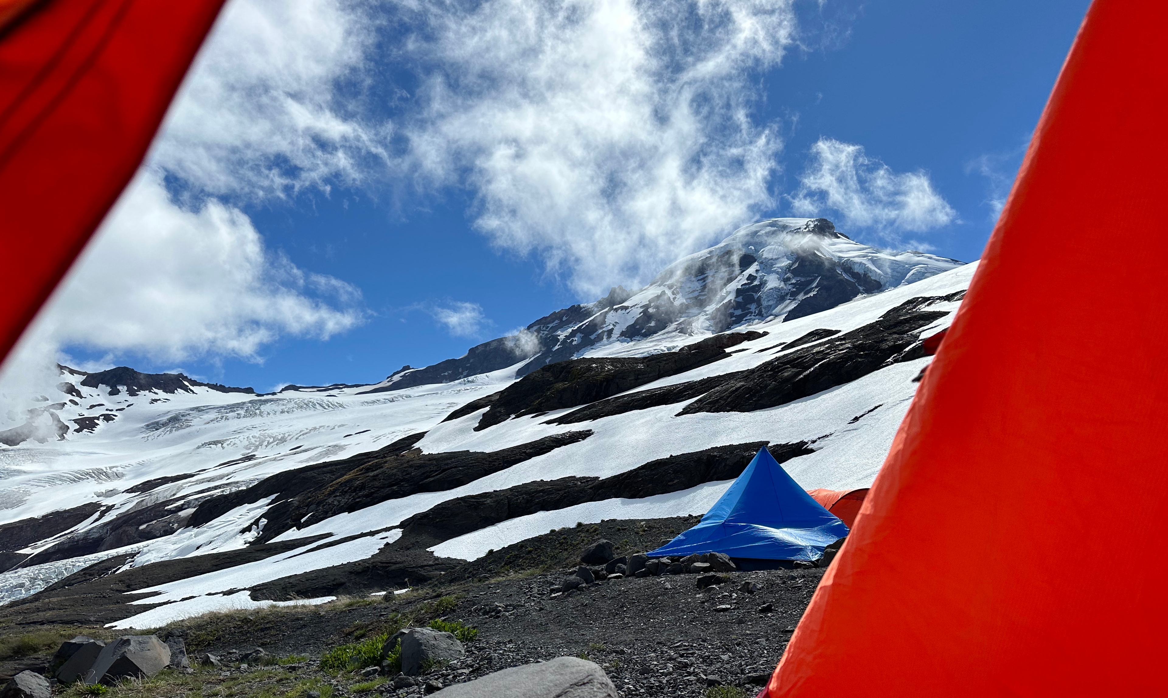 Blue tent in mountain wilderness - gear testing environment